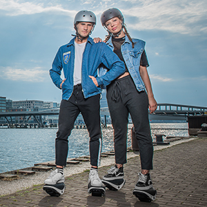 Man and Woman posing in Drift W1 skates